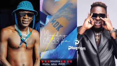 Shatta Wale tattoos Medikal MDK arm